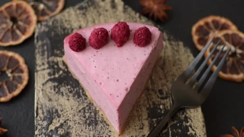 Raspberry or strawberry cheesecake, a slice of sweet red cake with berries. Rasp Stock Footage 321244220