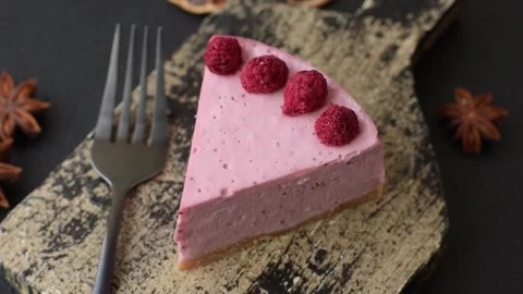 Raspberry or strawberry cheesecake, a slice of sweet red cake with berries. Rasp Stock Footage 321244225