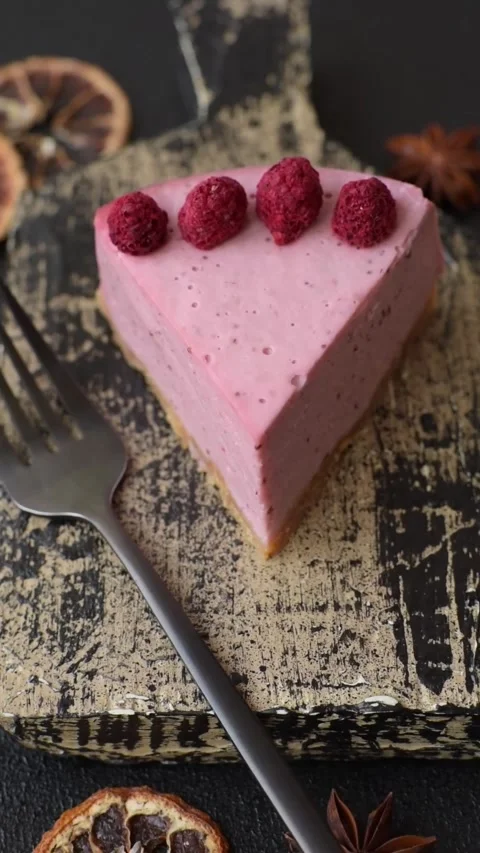 Raspberry or strawberry cheesecake, a slice of sweet red cake with berries. Rasp Stock Footage 321244230