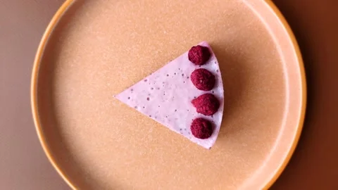 Raspberry or strawberry cheesecake, a slice of sweet red cake with berries. Rasp Stock Footage 321244302