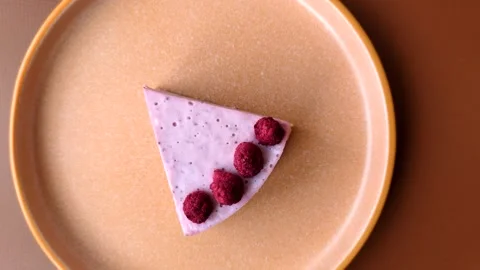 Raspberry or strawberry cheesecake, a slice of sweet red cake with berries. Rasp Stock Footage 321244319