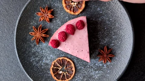 Raspberry or strawberry cheesecake, a slice of sweet red cake with berries. Rasp Stock Footage 321244350