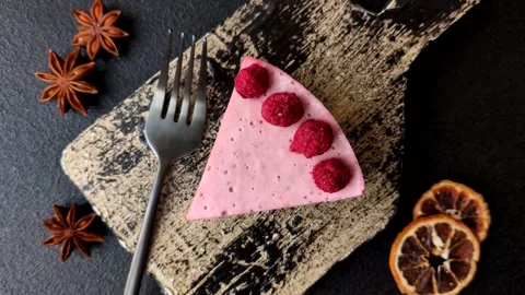 Raspberry or strawberry cheesecake, a slice of sweet red cake with berries. Rasp Stock Footage 321244360