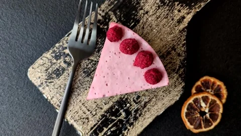 Raspberry or strawberry cheesecake, a slice of sweet red cake with berries. Rasp Stock Footage 321244364
