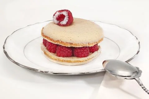 Raspberry pastry on a white background Stock Photos