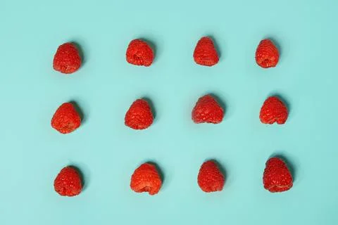 Raspberry pattern on the blue color of the lagoon. Fruits and healthy food,.. 写真素材