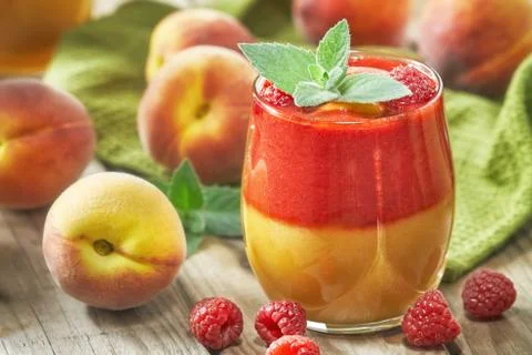 Raspberry peach smoothie Stock Photos