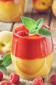 Raspberry peach smoothie Stock Photos