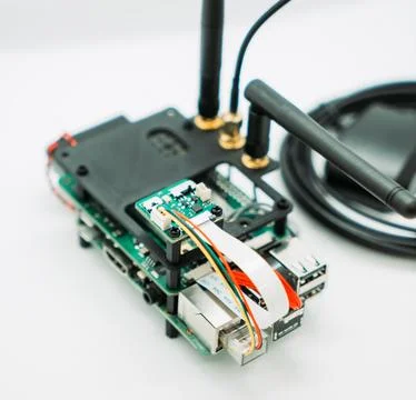 Raspberry Pi Microcomputer with Antennas and Cables on White Background Stock Photos