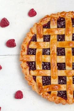 Raspberry pie with jam on white table. Top view. Stock Photos