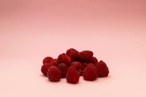 Raspberry on a pink background Stock Photos