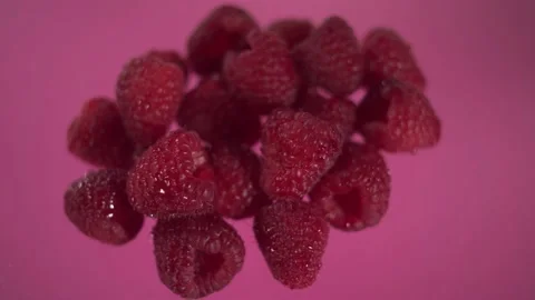 Raspberry on pink macro background Video stock 150479493