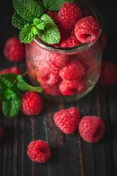 Raspberry. Raspberries in a Cup on a dark background. Summer and healthy food Stock Photos