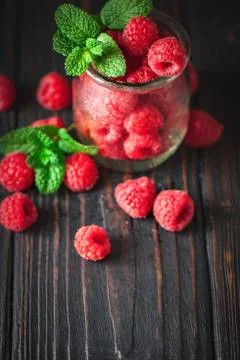 Raspberry. Raspberries in a Cup on a dark background. Summer and healthy food Stock Photos