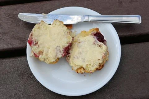 Raspberry scone on plate Stock Photos
