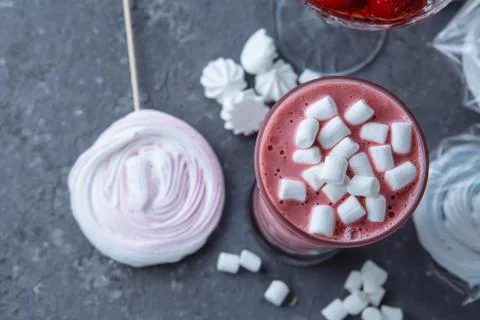 Raspberry smoothie with colored marshmallows and berries. Summer refreshing b Stock Photos