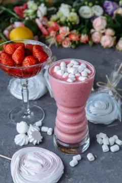Raspberry smoothie with colored marshmallows and berries. Summer refreshing b Stock Photos