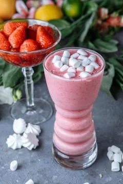Raspberry smoothie with colored marshmallows and berries. Summer refreshing b Stock Photos