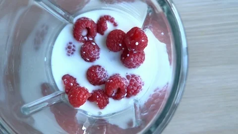 Raspberry smoothie fresh blended with fresh rapsberry, super slow motion video Stock Footage 91844951