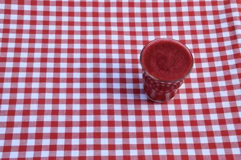 Raspberry smoothie on red-white Stock Photos