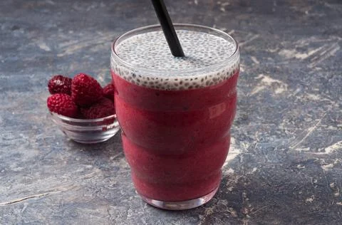 Raspberry smoothies on a grey background. Healthy diet Stock Photos