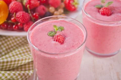 Raspberry smothies and raspberry fruit on the concrete background Stock Photos