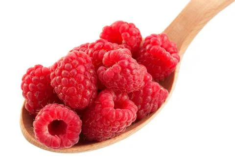 Raspberry in spoon on white Stock Photos