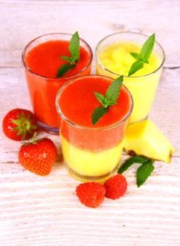 Raspberry, strawberry and pineapple smoothie in glass mixed Stock Photos