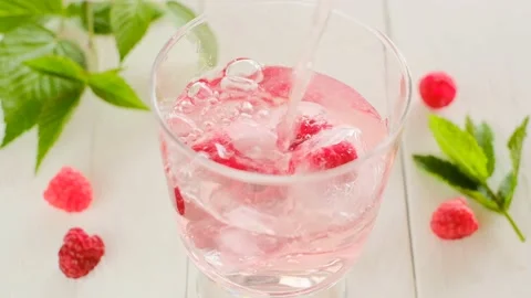 Raspberry summer cocktail. Summer drink.Splashes and drops Stock Footage 195183154