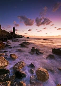 Raspberry sunset over the bewitching sea Stock Photos