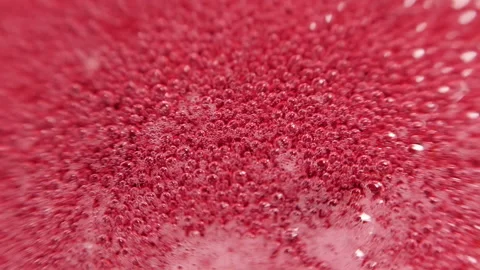 Raspberry syrup. Pink background with bubbling bubbles and raspberries. Stock Footage 141543479