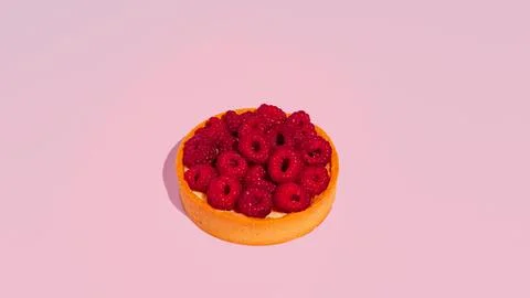 Raspberry tart on pink background. Copy space. Stock Photos