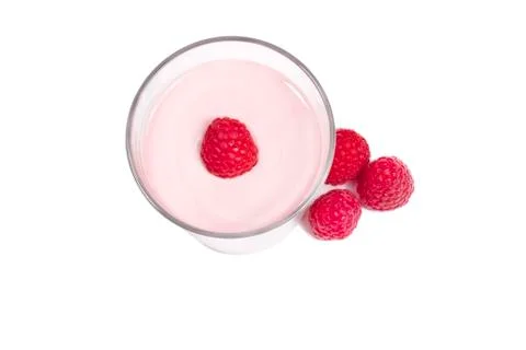 Raspberry on top of a milkshake with rapsberries aside from top Stock Photos