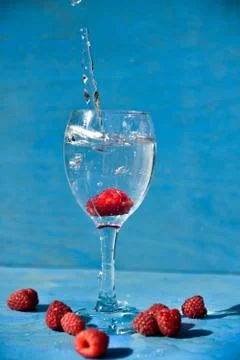 Raspberry in the water, art soft focus. Stock Photos