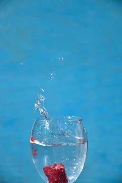 Raspberry in the water, art soft focus. Stock Photos