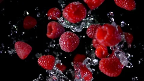 Raspberry with water fly to the camera Video stock 105574190