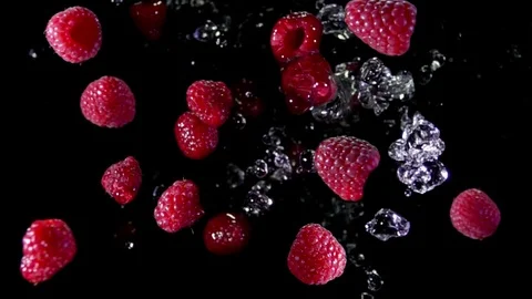 Raspberry with water fly to the camera Video stock 105877823