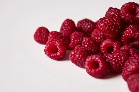 Raspberry on a white background, close-up red Stock Photos