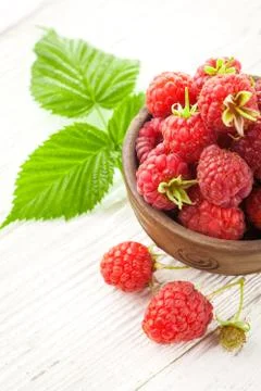 Raspberry on a white wooden table Stock Photos