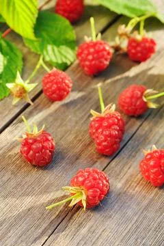 Raspberry on wooden table Raspberry with leafs on wooden table Copyright: ... Foto stock