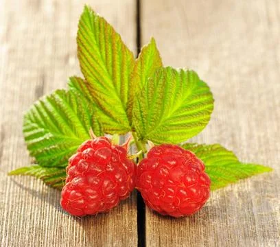 Raspberry on wooden table Raspberry with leafs on wooden table Copyright: ... Foto stock