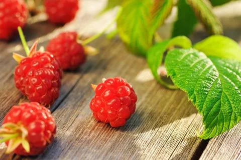 Raspberry on wooden table Raspberry with leafs on wooden table Copyright: ... Foto stock