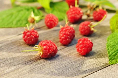 Raspberry on wooden table Raspberry with leafs on wooden table Copyright: ... Foto stock