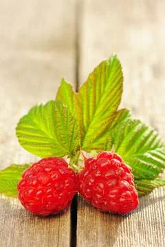 Raspberry on wooden table Raspberry with leafs on wooden table Copyright: ... Foto stock