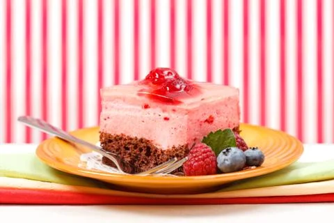 Raspberry yoghurt cake garnished with berries Stock Photos