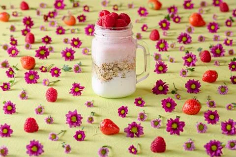 Raspberry yogurt with muesli in a jar Stock Photos