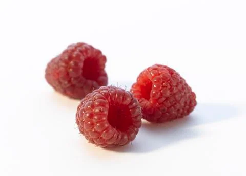 Raspberrys on white ground Stock Photos