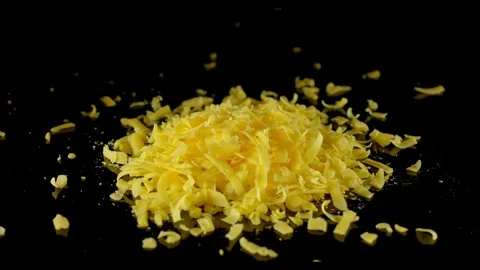 Rasped Cheddar falls down Stock Footage 104856046