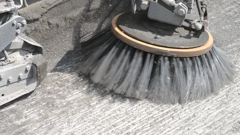 Rasped road asphalt being cleaned with wheel brush. Stock Footage 113325428