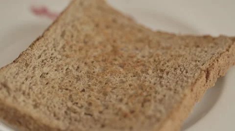 Rasperry jam  on toasted bread Stock Footage 50618271